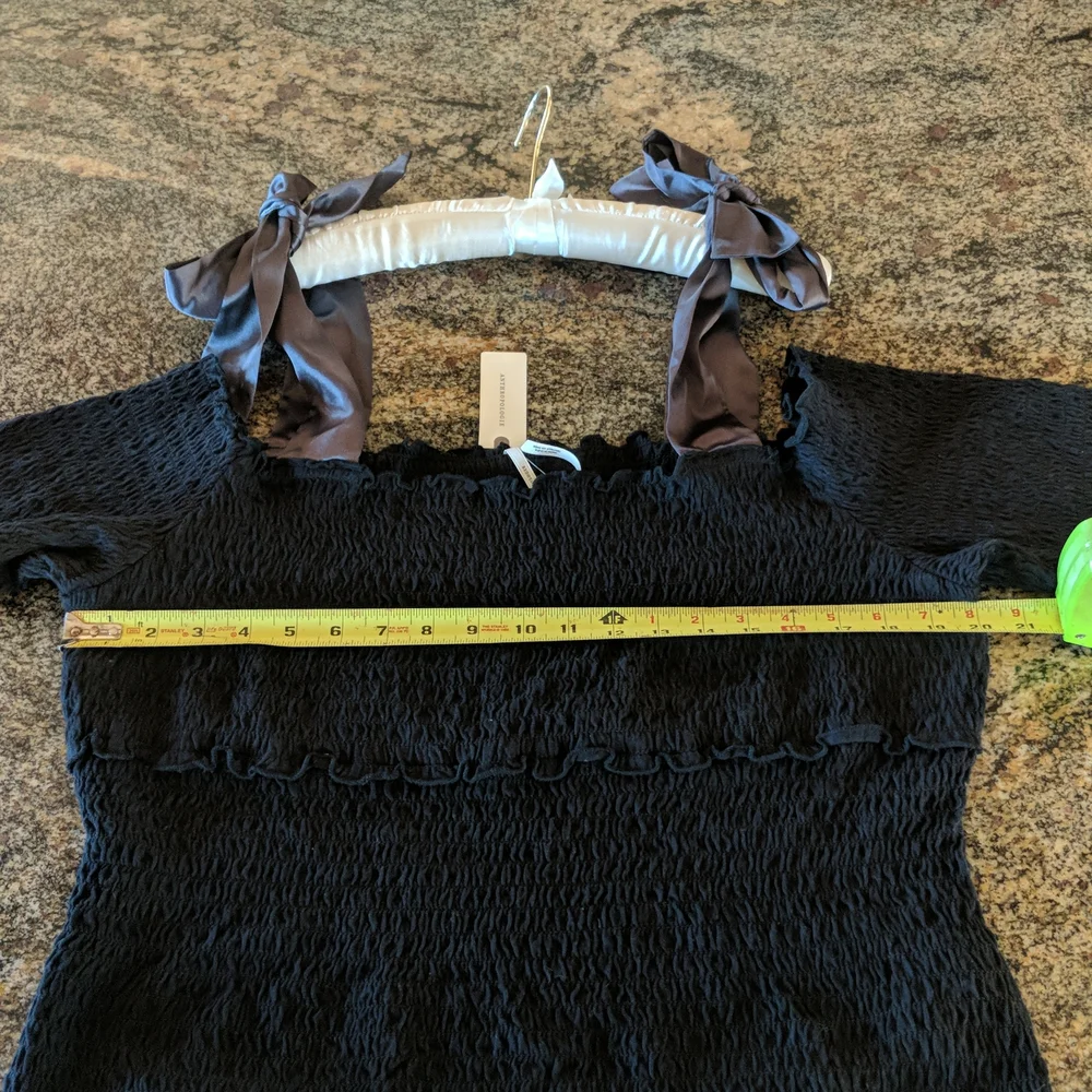 Anthropologie bow off shoulder smocked top black
